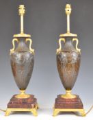 Pair of gilt metal, bronze and marble table lamps formed as twin handled urns with classical
