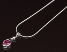 An 18ct white gold pendant set with an oval cut tourmaline of approximately 1.6ct and a round cut