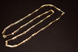 A 9ct gold necklace made up of elongated and knotted links, 23.5g, 66cm