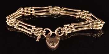 A 9ct rose gold gate bracelet with heart padlock clasp, 9.2g, 17cm