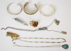 A collection of silver jewellery including three bangles, brooch in the form of three swallows set