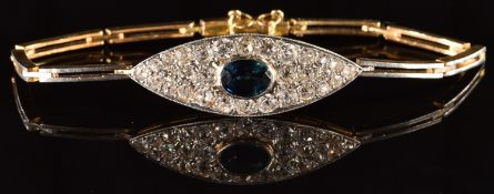 An 18ct gold bracelet set with an oval cut sapphire of approximately 0.75ct and old cut diamonds,