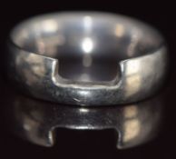 An 18ct white gold wedding band / ring made to fit around an engagement ring, 8.1g, size M/N