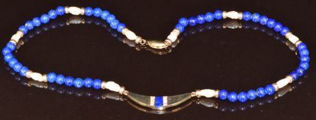 A beaded necklace made up of lapis lazuli, freshwater pearl and 9ct gold beads with 9ct gold section