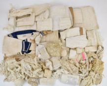 A large collection of vintage lace including some lengths on card, and an Edwardian child's sailor