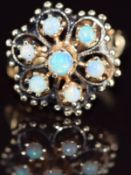 A 14k gold ring set with opals in a flower cluster, 4.1g, size J/K