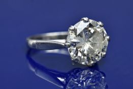 A platinum ring set with a round brilliant cut diamond of approximately 6.7ct, with AnchorCert