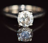 An 18ct white gold ring set with round cut diamond measuring 1ct, with insurance valuation, 2.6g,