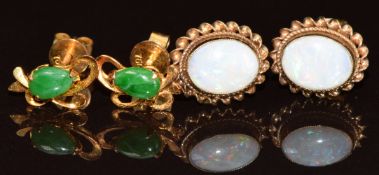 A pair of 18ct gold earrings each set with a pear cut jadeite cabochon (1.2g) and a pair of 9ct gold