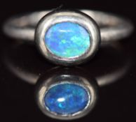 An 18ct white gold ring set with an opal doublet, 6g, size N