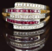 An 18ct gold ring set with calibre cut rubies and round cut diamonds, the total ruby weight