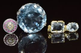 A white metal pendant set with a round cut aquamarine, spinel and topaz (12.6g), a 14k gold