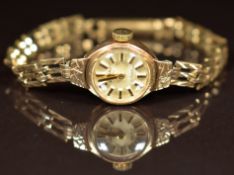 Rotary 9ct gold ladies wristwatch with two-tone hands and baton hour markers, silver dial and signed