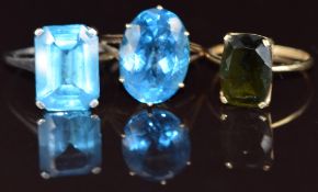 Three rings comprising two 9ct gold and one 9k white gold, two set with topaz and one with paste,