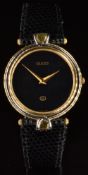 Gucci 4500M wristwatch with gold dauphine hands, black dial, gold plated case and quartz movement,