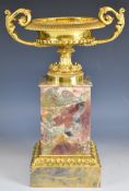 Gilt metal and marble pedestal twin handled urn, on square base, height 40cm