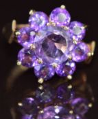 A 9ct gold ring set with a cluster of amethysts, 4.3g, size L