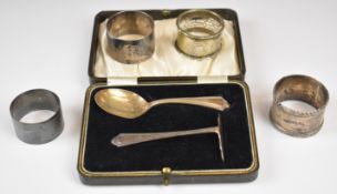 Cased hallmarked silver spoon and pusher set, two hallmarked silver napkin rings and two silver