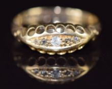 An 18ct gold ring set with five diamonds, Chester 1911, 1.7g, size K
