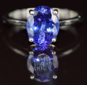A platinum ring set with an oval cut tanzanite of approximately 4.2ct, 5.9g, size Q