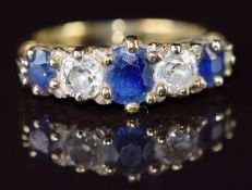 A c1900 18ct gold ring set with three sapphires, two old cut diamonds each approximately 0.35ct