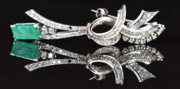 A platinum brooch set with an emerald cut emerald of approximately 1.2ct and diamonds, 7g, 5.5cm
