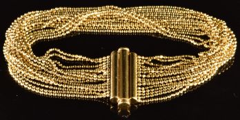 A 9ct gold bracelet made up of sixteen strands of gold beads, 14.1g, 18cm