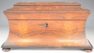 Victorian rosewood sarcophagus shaped two division tea caddy with space for a mixing bowl, raised on