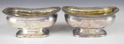 Pair of Georgian hallmarked silver open salts with gadrooned edges, gilt interiors and crest with