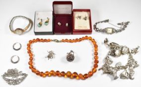 A collection of silver including charm bracelet with 12 silver charms including seahorse, dog,