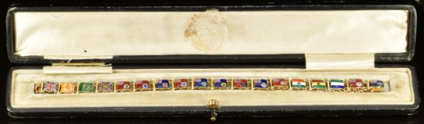 A 14ct gold bracelet made up of flag shaped links set with enamel, each flag representing a