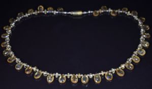 A beaded necklace made up of briolette cut citrines, 23.9g, 40cm