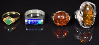 An 18ct gold ring set with a jadeite cabochon (1.6g, size M), two silver rings and another ring