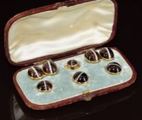 Victorian yellow metal cufflinks, three buttons and stud, all set with banded agate cabochons, in