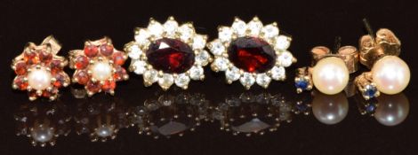 Three pairs of 9ct gold earrings, one pair set with a cultured pearl and sapphire, one with garnet