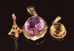 A 9ct gold pendant set with citrine, Victorian pendant set with paste and 9ct gold Eiffel Tower