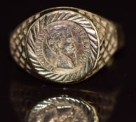 A 9ct gold ring set with a replica coin, 2.1g, size P