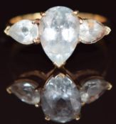 A 9ct gold ring set with three pear cut aquamarines, 3.8g, size U