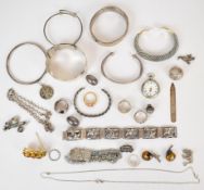 A collection of silver jewellery including Norwegian bracelet, seven rings, six bangles, earrings