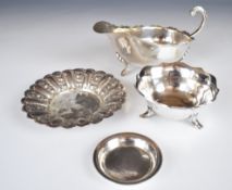 Indian and Middle Eastern silver items comprising lobed bowl, pin dish and bowl raised on three feet