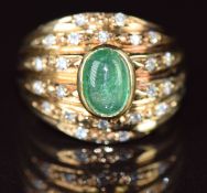 An 18k gold ring set with an emerald cabochon and diamonds, 6.5g, size I