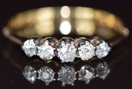An 18ct gold ring set with five old cut diamonds, 2.3g, size S