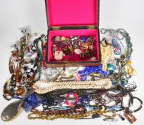 A collection of jewellery including beaded necklaces, filigree brooch, silver backed brush, Siam