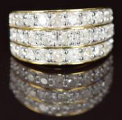A 10k gold ring set with three rows of diamonds, 5g, size N