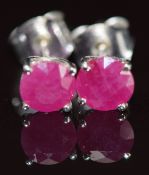 A pair of 18k white gold earrings each set with ruby of approximately 0.6ct, 1.3g