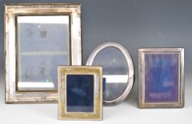 Four various hallmarked silver photograph frames, all with easel backs, overall height of tallest
