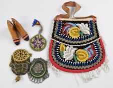 Beadwork items including a cut steel decorated purse, similar example with gilt mounts and beads,