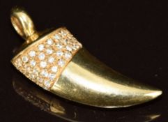 A yellow metal pendant in the form of a tooth set with diamonds (tests as 14k), 7.4g, 3.3cm