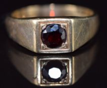 A 9ct gold ring set with a round cut garnet, 8.7g, size Y