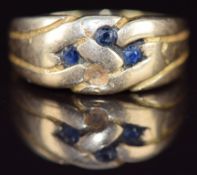 An 18ct gold ring with sapphires (one missing), 5.4g, size O